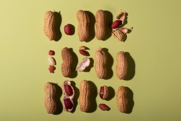 Top view peanuts on green background