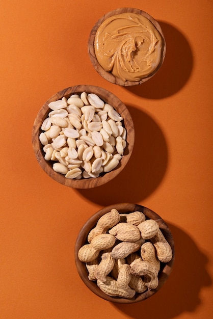 Top view peanuts on orange background