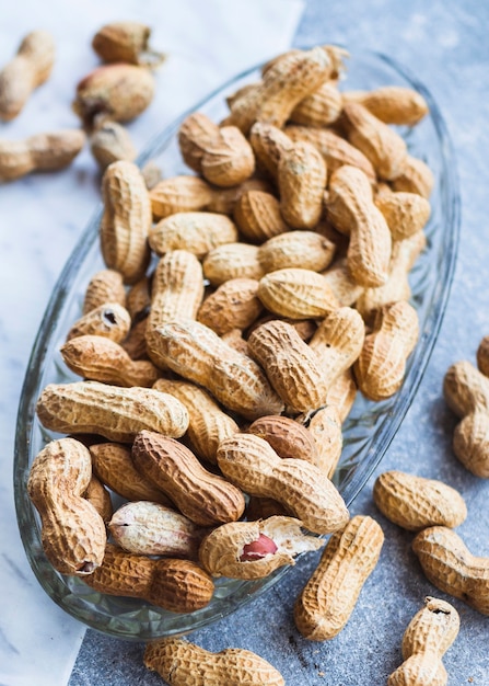 Free photo top view of peanuts seed in the glass bowl