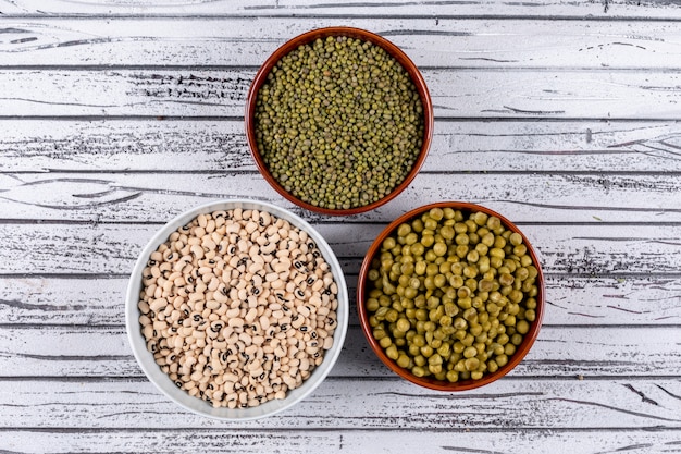 Free Photo top view of peas and beans in bowls