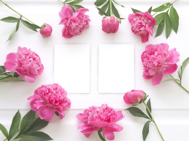 Free Photo top view of peony flower frame with clear white paper