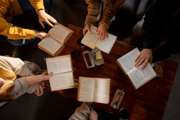 Top view people reading together