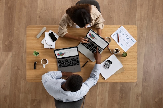 Top view people working at desk