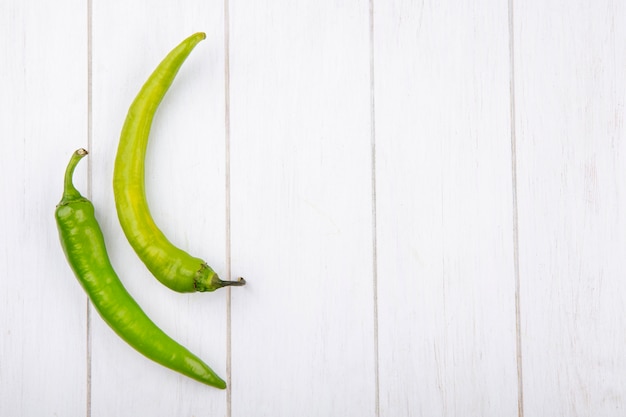 Top view of peppers on wooden surface