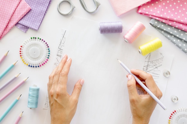 Top view of person designing garment to sew