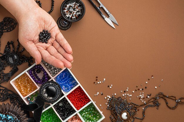 Top view of person doing bead work