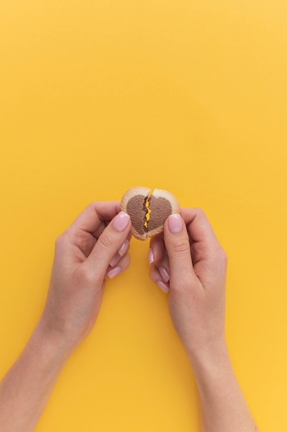 Top view of person holding broken heart treat