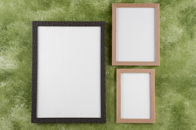 Free photo top view of photo frames on textured surface