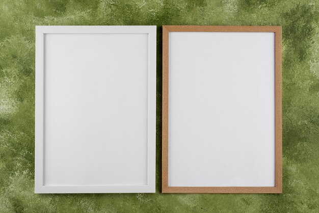 Top view of photo frames on textured surface