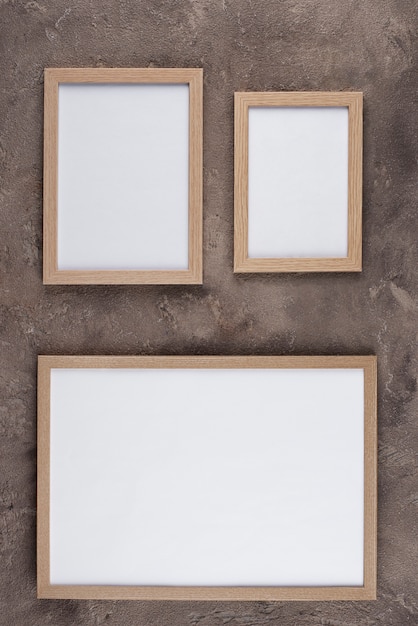 Top view of photo frames on textured surface