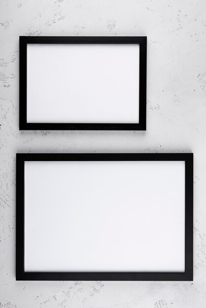 Top view of photo frames on textured surface