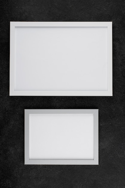 Top view of photo frames on textured surface