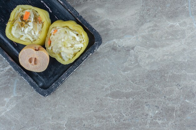 Top view of pickled peppers filled with sauerkraut. 