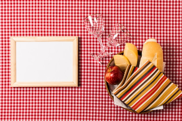 Free Photo top view picnic assortment next to empty frame