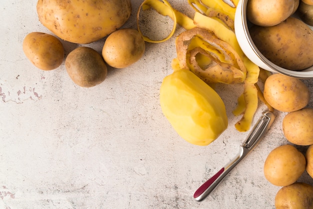 Top view pile of raw potatoes with copy space