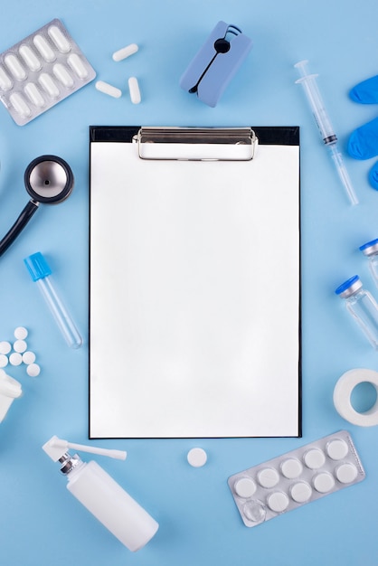 Top view pills and clipboard arrangement