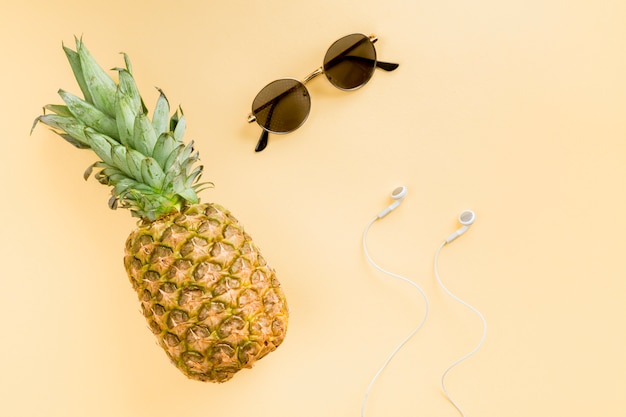 Free photo top view pineapple with sunglasses