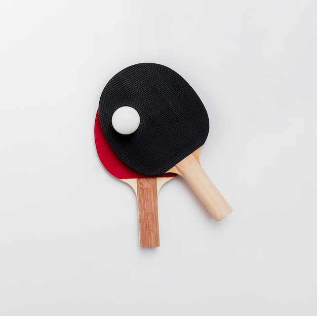 Free photo top view of ping pong paddles with ball