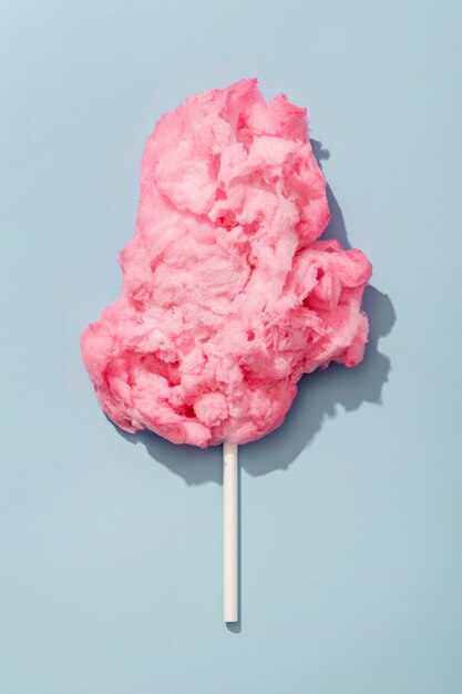 Top view of pink cotton candy on stick