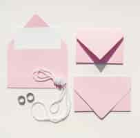 Free photo top view pink envelopes for wedding invitations