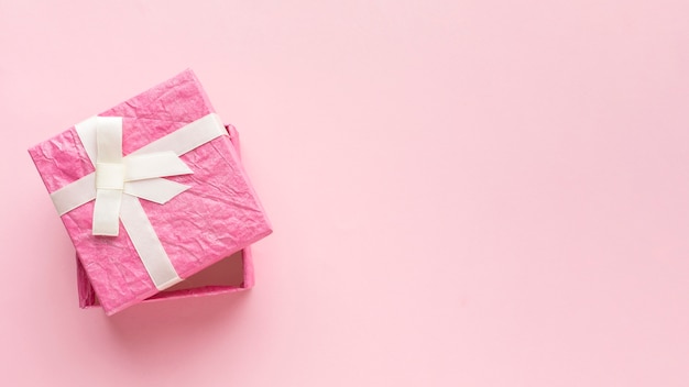 Top view of pink gift box with copy space