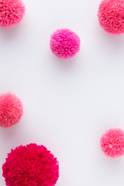 Free Photo top view pink pom poms arrangement