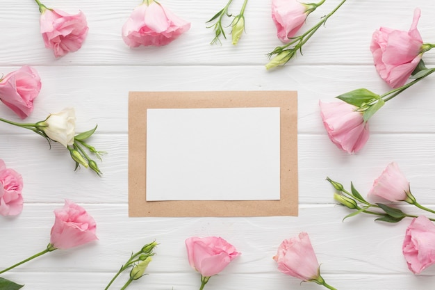 Free photo top view  pink roses arrangement with frame