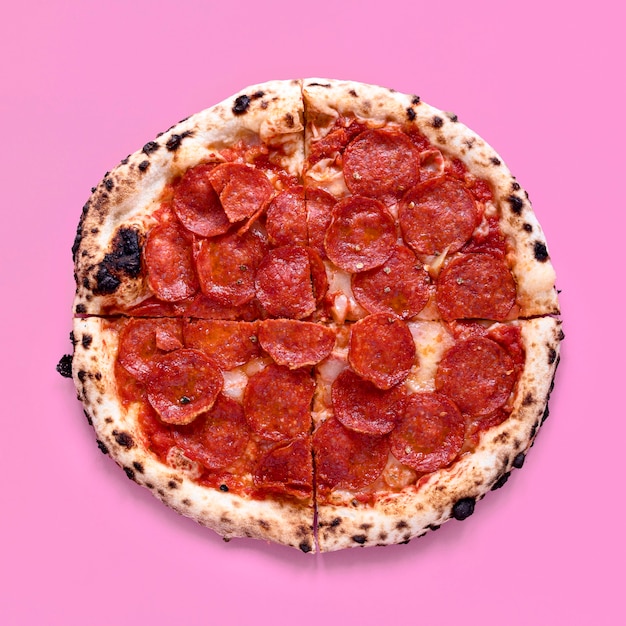 Free photo top view pizza on pink background