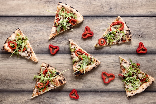 Free photo top view pizza slices arrangement