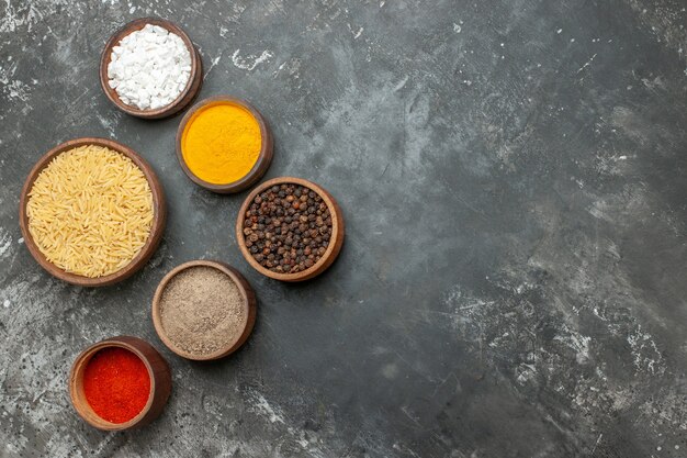 Top view of plain boiled rice with different spices