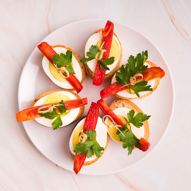 Free Photo top view plate with boiled eggs and vegetables