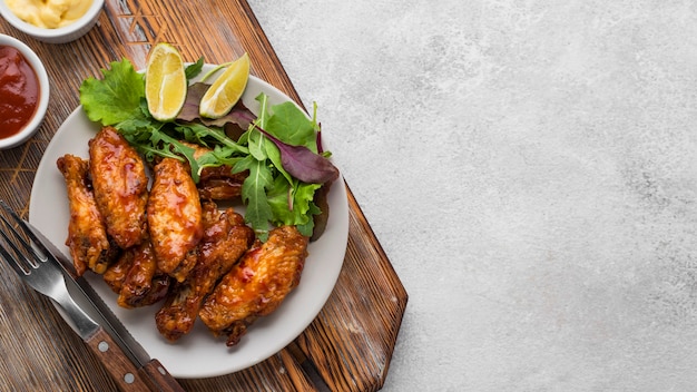 Top view of plate with fried chicken and copy space