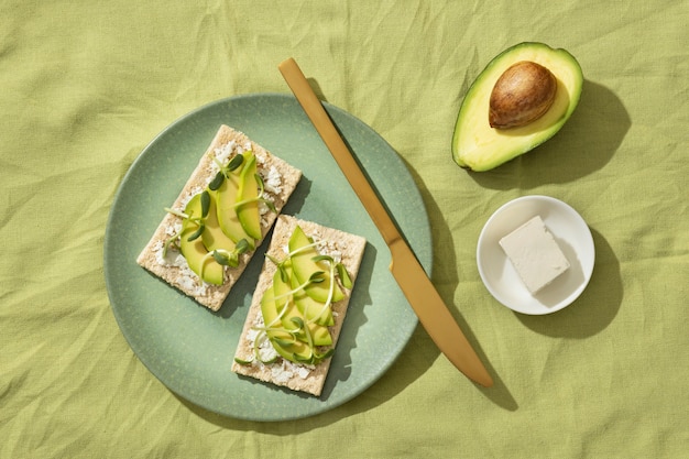 Free photo top view of plate with keto diet food and avocado