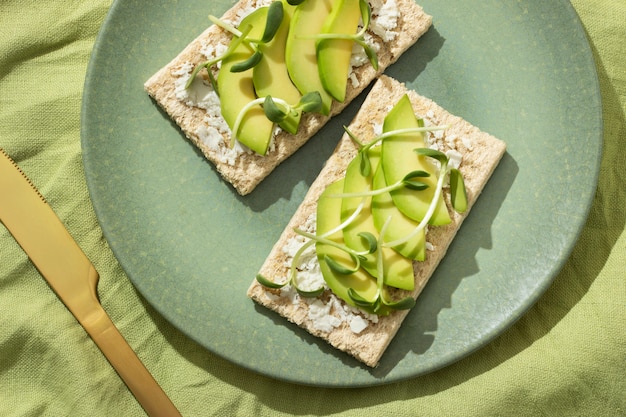 Free photo top view of plate with keto diet food and golden knife