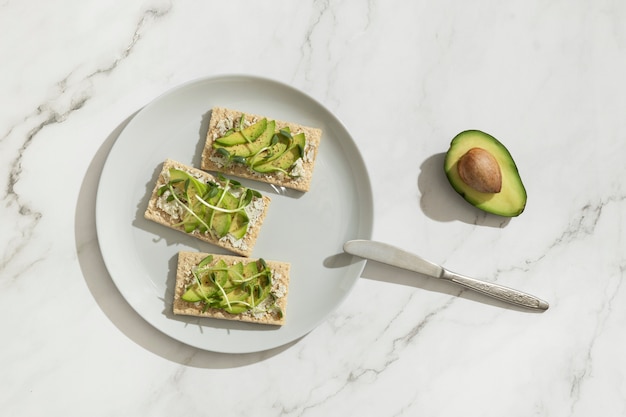 Free photo top view of plate with keto diet food and a knife