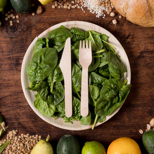 Top view plate with spinach leaves