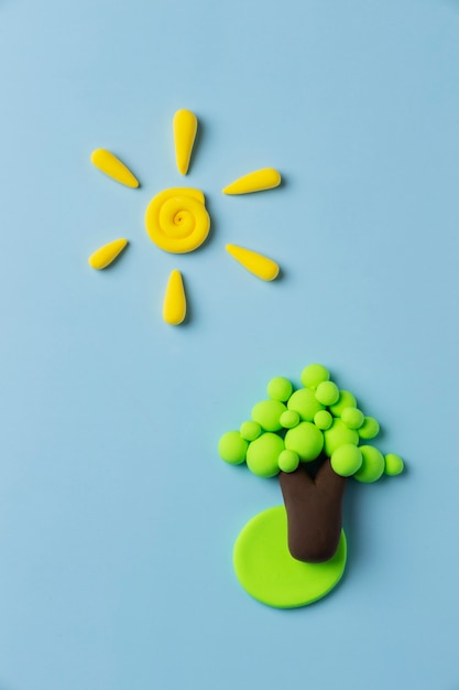 Free photo top view play dough sun and tree