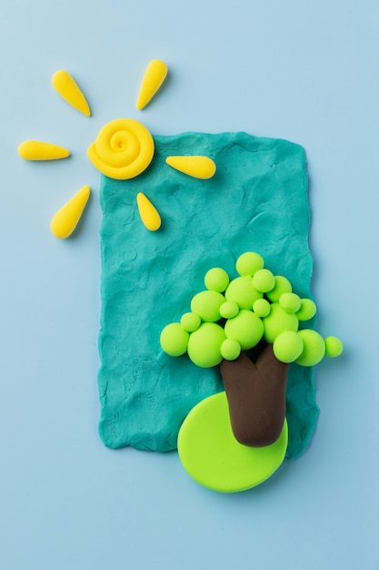 Free photo top view play dough tree and sun