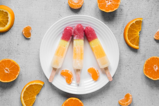 Top view of popsicles with orange