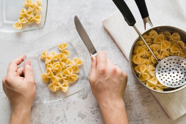 Top view pot full of raw pasta