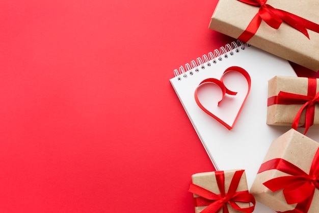 Top view of presents and paper heart shape with copy space