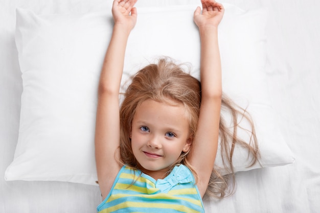 Free photo top view of pretty child has long hair