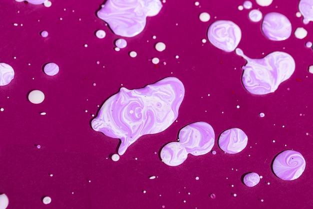 Free Photo top view purple paint splash on purple background