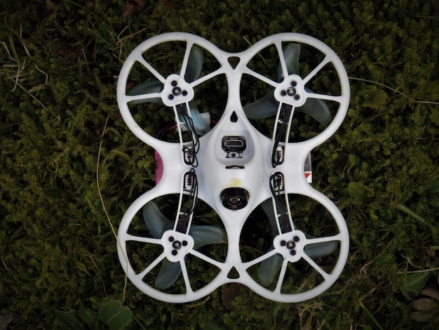 Free Photo top view of a quadrotor on the grassy ground