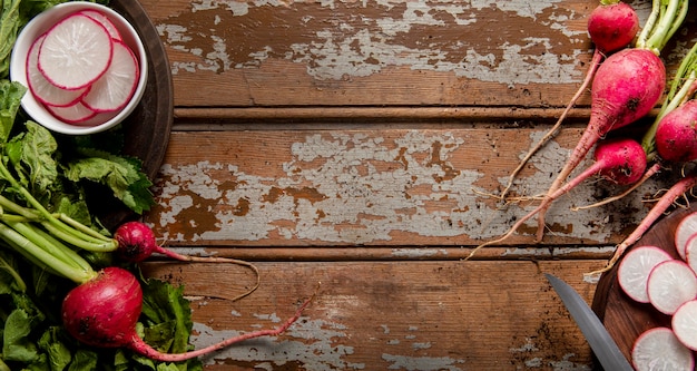 Free Photo top view of radishes on wooden surface