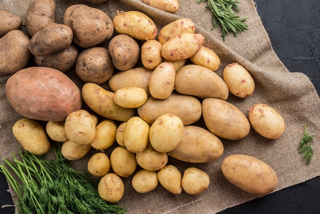 Top view raw potatoes on table