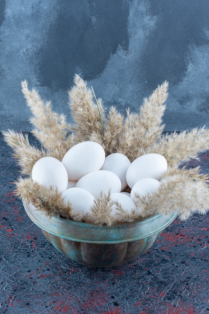 Free Photo top view of raw white chicken eggs .