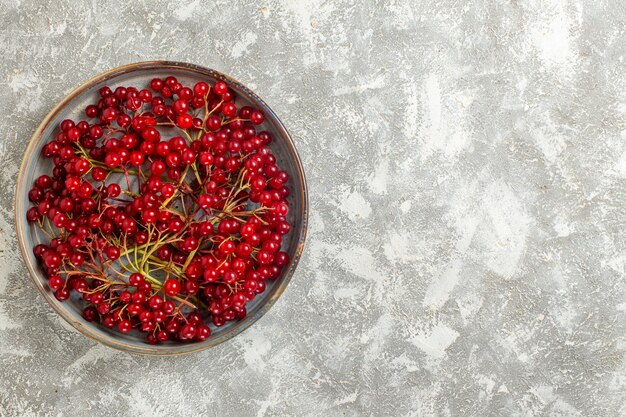 Top view red berries mellow fruits on the white background