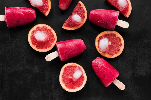 Top view of red grapefruit popsicles