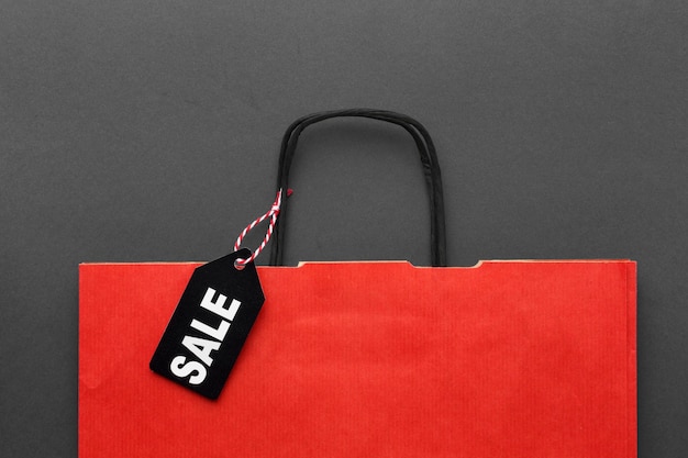 Top view red shopping bag  with sale label